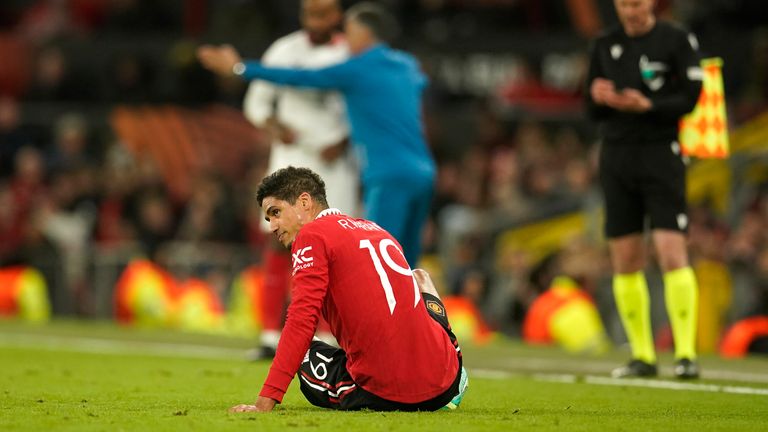 Raphael Varane sits on the pitch after a setback