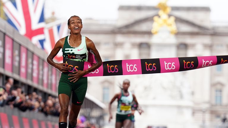 Hassan smiles as she crosses the line first in London