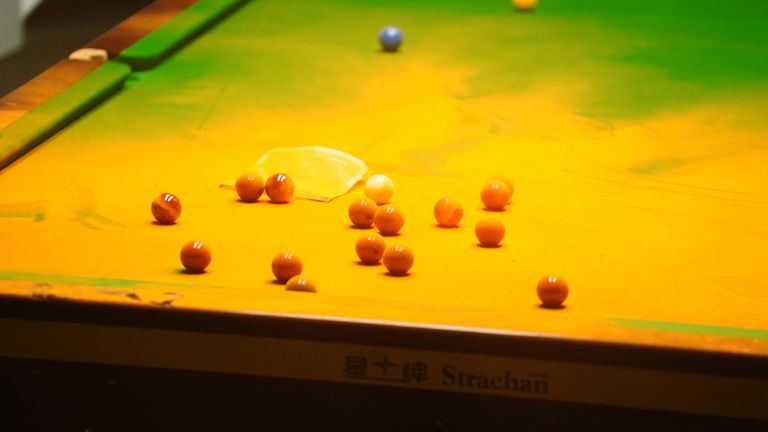 Orange powder on the table after a Just Stop Oil protester interrupted the match between Robert Milkins and Joe Perry