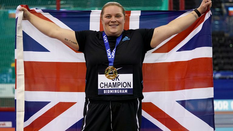 Sophie McKinna celebrates with the gold medal after winning the Women&#39;s Shot Put Final at the UK Athletics Indoor Championships
