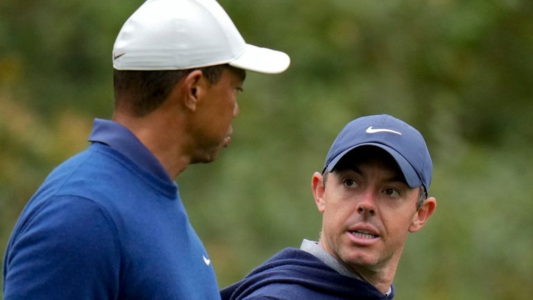 Tiger Woods and Rory McIlroy, of Northern Ireland, walk on the 11th fairway during a practice for the Masters golf tournament at Augusta National Golf Club, Monday, April 3, 2023, in Augusta, Ga. (AP Photo/Jae C. Hong)