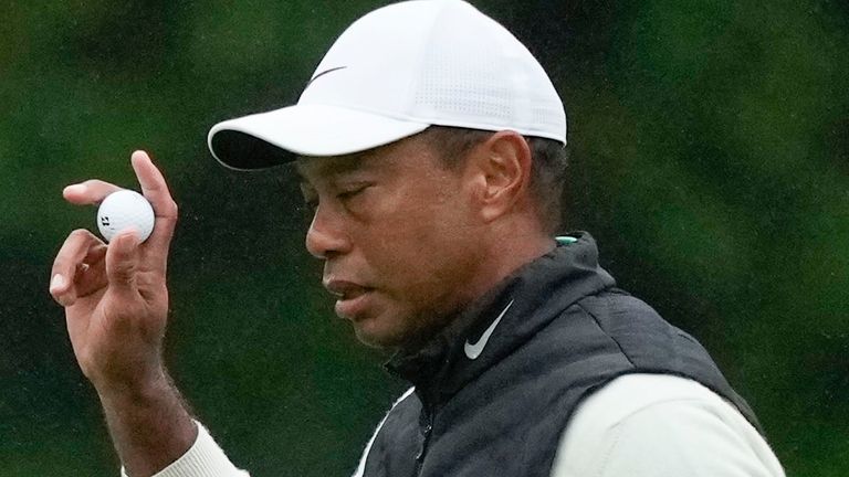 Tiger Woods waves after his putt on the 15th hole during the weather delayed second round of the Masters golf tournament at Augusta National Golf Club on Saturday, April 8, 2023, in Augusta, Ga. (AP Photo/Matt Slocum)