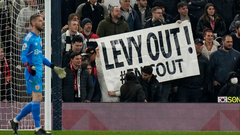 Tottenham fans hold up a 'Levy Out' banner at the Tottenham Hotspur Stadium