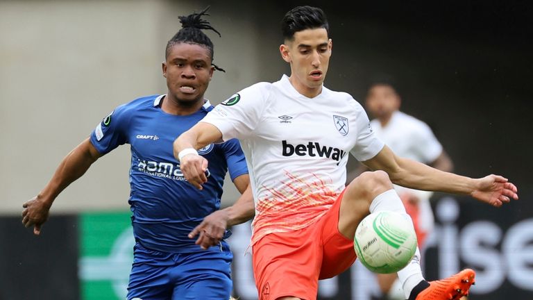 West Ham's Nayef Aguerd, right, passes the ball as Gent's Gift Orban tries to stop him 