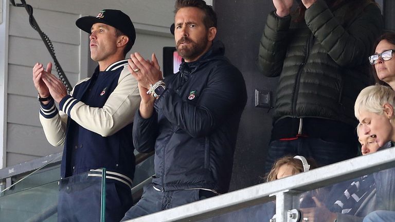 Wrexham�s owners Ryan Reynolds and Rob McElhenney applaud the teams out on to the pitch during the match against Notts County�s during the Vanarama National League match at the Racecourse Ground, Wrexham. Picture date: Monday April 10, 2023.
