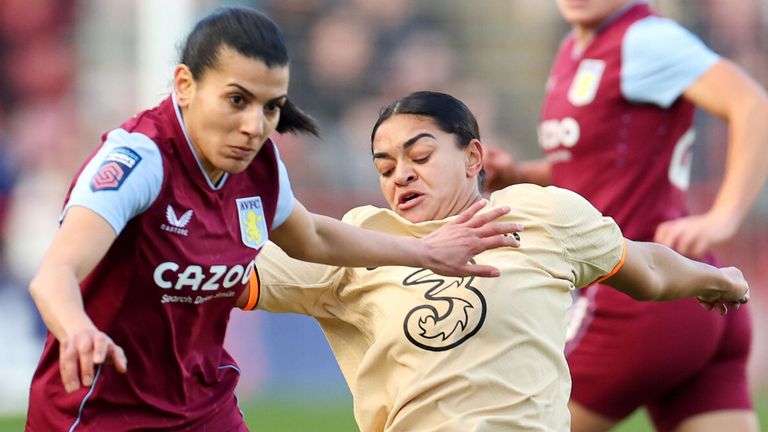 Kenza Dali and Jess Carter battle for the ball