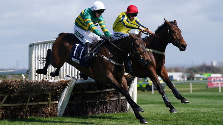 Zenta (left) and Mark Walsh tackles Bo Zenith at the last at Aintree