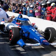Alex Palou celebrates pole position for the 2023 Indy 500 with his Chip Ganassi team
