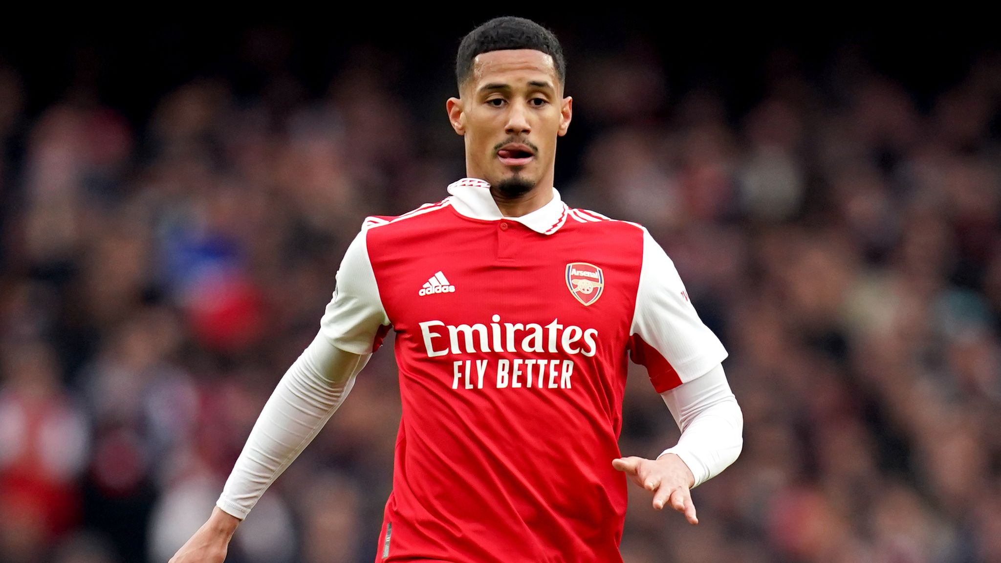 William Saliba and Gabriel of Arsenal defend against Manchester City during a Premier League match at the Emirates Stadium in London, England.
