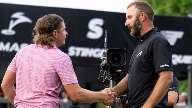 Captain Cameron Smith of Ripper GC shakes hands with Captain Dustin Johnson of 4Aces GC on the 18th green during the playoff of LIV Golf Tulsa at the Cedar Ridge Country Club on Sunday, May. 14, 2023 in Broken Arrow, Oklahoma. (Photo by Reagan Renfroe/LIV Golf via AP)