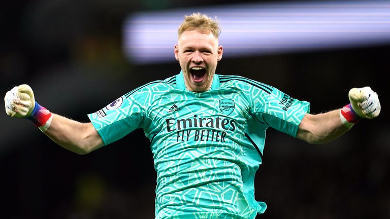 Arsenal's Aaron Ramsdale reacts to Martin Odegaard's strike against Tottenham