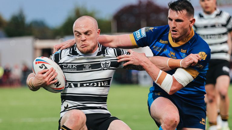 Picture by Alex Whitehead/SWpix.com - 11/05/2023 - Rugby League - Betfred Super League - Wakefield Trinity v Hull FC - Be Well Support Stadium, Wakefield, England - Hull FC’s Adam Swift is tackled by Wakefield’s Lee Gaskell