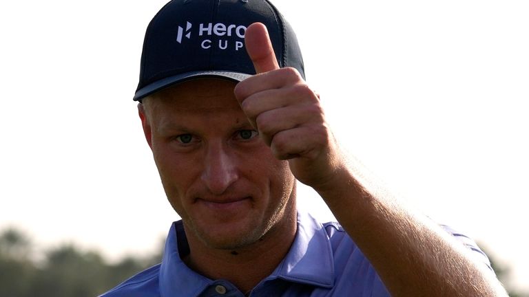 Adrian Meronk of Poland and The Continent of Europe, celebrates his match winning putt on the 18th green, during the final round of the Hero Cup at Abu Dhabi Golf Club, in Abu Dhabi, United Arab Emirates, Sunday, Jan. 15, 2023. (AP Photo/Kamran Jebreili)