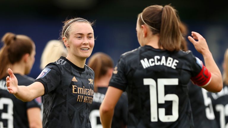 Caitlin Foord of Arsenal celebrates with teammate Katie McCabe after scoring the team's third goal during the FA Women's Super League match between Everton FC and Arsenal 