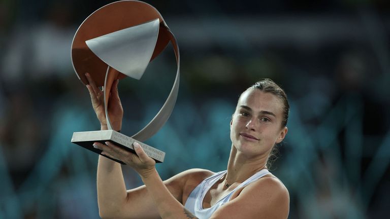 Belarus' Aryna Sabalenka poses for pictures with the winner's trophy after beating Poland's Iga Swiatek during their 2023 WTA Tour Madrid Open tennis tournament singles final match at Caja Magica in Madrid on May 6, 2023. (Photo by Thomas COEX / AFP) (Photo by THOMAS COEX/AFP via Getty Images)