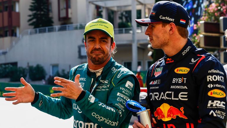 CIRCUIT DE MONACO, MONACO - MAY 27: Fernando Alonso, Aston Martin F1 Team, and pole man Max Verstappen, Red Bull Racing, talk in Parc Ferme during the Monaco GP at Circuit de Monaco on Saturday May 27, 2023 in Monte Carlo, Monaco. (Photo by Zak Mauger / LAT Images)