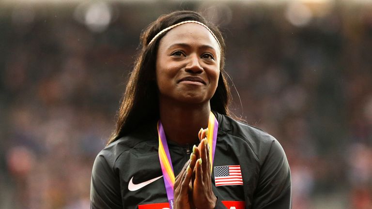 United States' Tori Bowie gestures after receiving the gold medal she won in the women's 100m final during the World Athletics Championships in London 