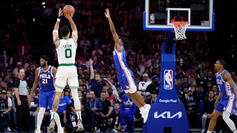 Boston Celtics' Jayson Tatum shoots against Philadelphia 76ers' Tyrese Maxey.