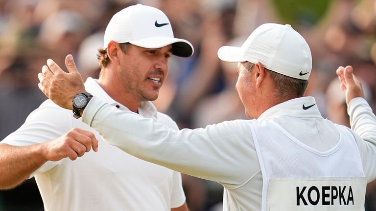 Brooks Koepka celebrates with his caddie Ricky Elliott after winning the PGA Championship golf tournament at Oak Hill Country Club on Sunday, May 21, 2023, in Pittsford, N.Y. (AP Photo/Abbie Parr)
