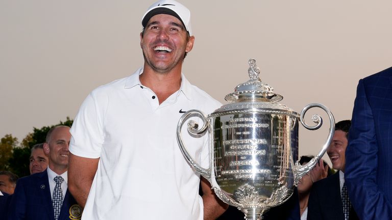 Brooks Koepka poses with the Wanamaker trophy after winning the PGA Championship