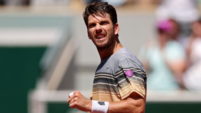 Cameron Norrie of Great Britain celebrates winning match point against Benoit Paire of France during their Men&#39;s Singles First Round Match on Day Two of the 2023 French Open at Roland Garros on May 29, 2023 in Paris, France. (Photo by Julian Finney/Getty Images)