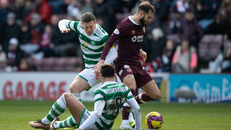 EDINBURGH, SCOTLAND - MARCH 11: Hearts' Jorge Grant beats Celtic's Callum McGregor and Sead Haksabanovic to the ball during a Scottish Cup Quarter-Final match between Heart of Midlothian and Celtic at Tynecastle, on March 11, 2023, in Edinburgh, Scotland.  (Photo by Paul Devlin / SNS Group)