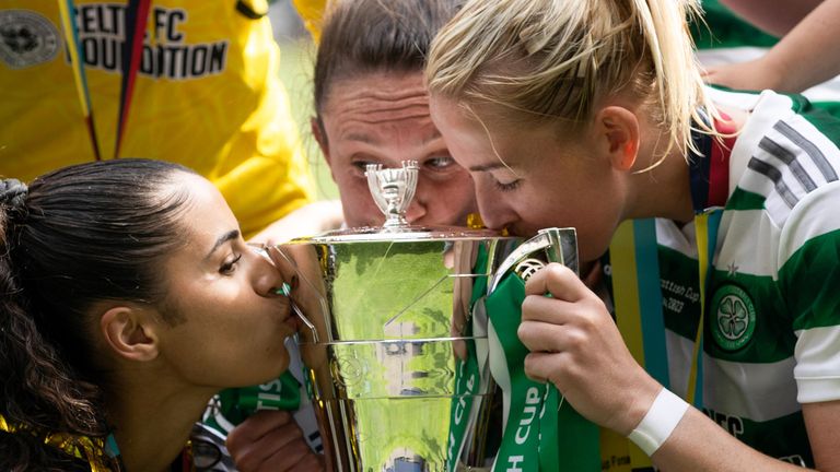 GLASGOW, SCOTLAND - MAY 28: Celtic's Jacynta Galabadaarachchi, Kelly Clark and Chloe Craig kiss the Scottish Cup during the Women's Scottish Cup Final match between Celtic and Rangers at Hampden Park, on May 28, 2023, in Glasgow, Scotland.  (Photo by Craig Williamson / SNS Group)