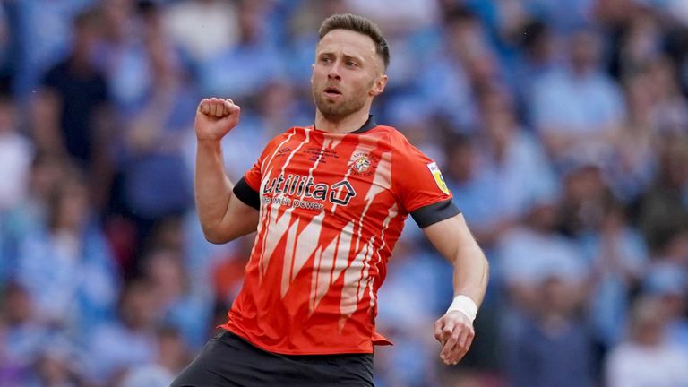 Jordan Clark leaps in celebration after scoring Luton&#39;s opening goal in the Championship play-off final