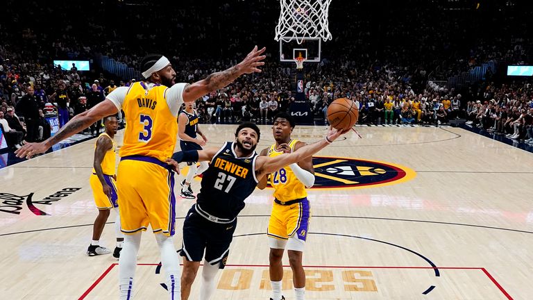 Denver Nuggets guard Jamal Murray shoots under Los Angeles Lakers forward Anthony Davis 