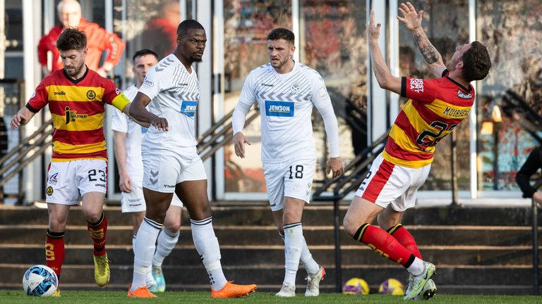 AYR, SCOTLAND - MAY 26: Partick Thistle's Aaron Muirhead falls behind after being pushed by Ayr's Dipo Akinyemi during the Cinch Premiership Play-Off Semi Final match between Ayr United and Partick Thistle at Somerset Park, May.  26, 2023, in Ayr, Scotland.  (Photo by Alan Harvey/SNS Group)