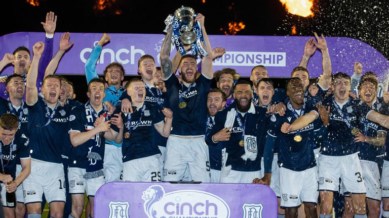 Dundee's Ryan Sweeney lifts the trophy during a cinch Championship match between Queen's Park and Dundee at Ochilview Park,