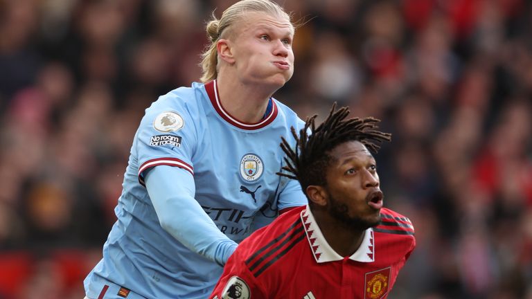 Erling Haaland tussles with Fred during the Manchester derby at Old Trafford in January