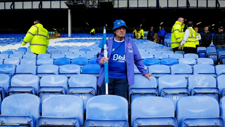 An Everton fan stands dejected at Goodison Park