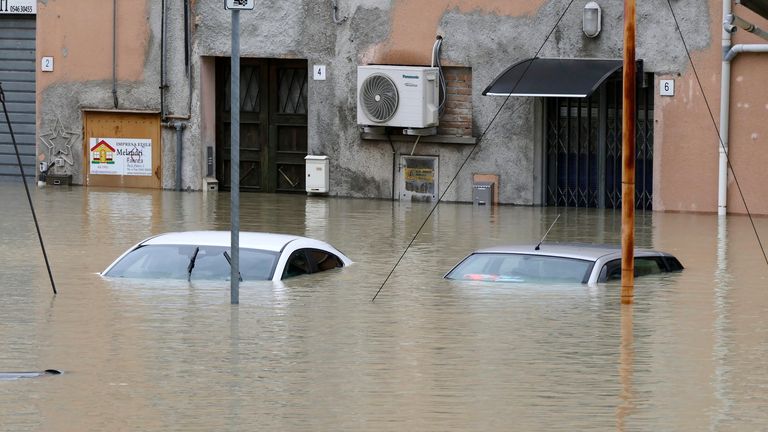 Cars are submerged in a flooded road in the city of Faenza. Heavy rains have caused flooding in the Emilia-Romagna region of Italy