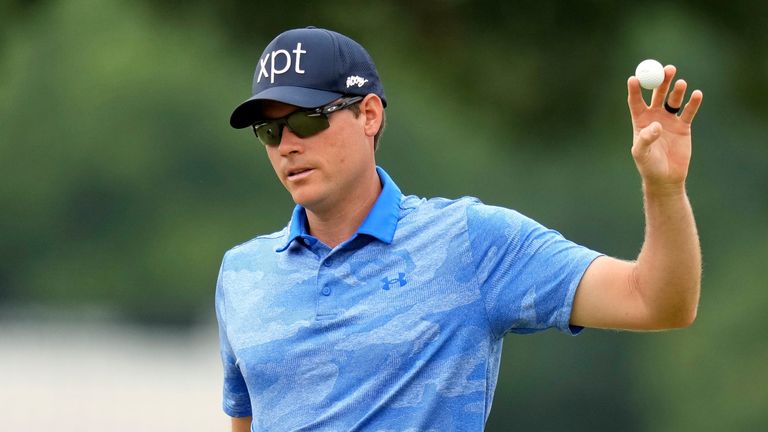 Adam Schenk waves his ball after sinking a putt on the 18th hole at the Charles Schwab Challenge (Associated Press)