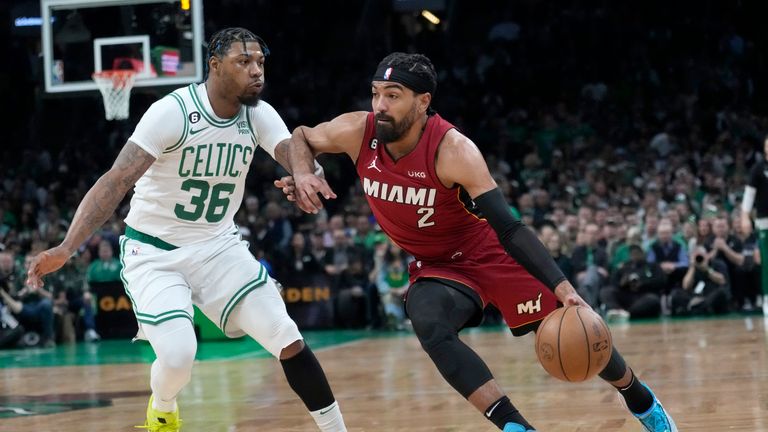 Miami Heat guard Gabe Vincent drives to the basket against Boston Celtics guard Marcus Smart during the first half of Game 2 of the NBA basketball playoffs Eastern Conference final in Boston, Friday, May 19, 2023.