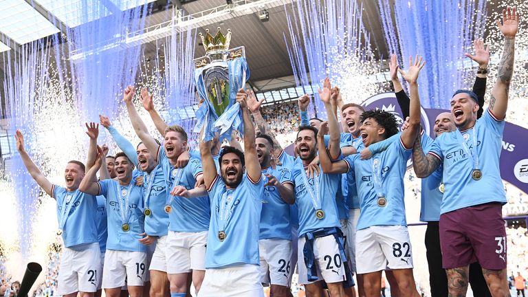 Ilkay Gundogan lifts the Premier League trophy