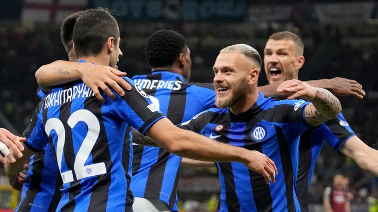 Inter Milan's Henrikh Mkhitaryan, center, celebrates with his teammates after scoring his side's second goal during the Champions League semifinal first leg soccer match between AC Milan and Inter Milan at the San Siro stadium in Milan, Italy, Wednesday, May 10, 2023. (AP Photo/Antonio Calanni)