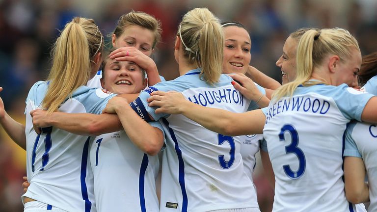 Izzy Christiansen (second left) is mobbed by her team-mates after scoring for England in 2017.