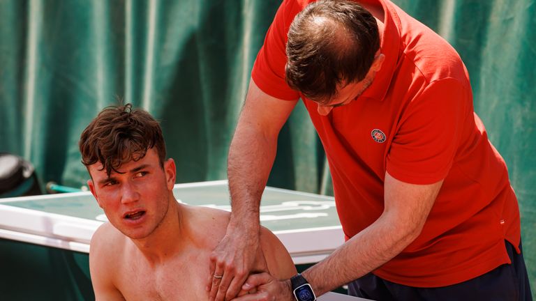Jack Draper of Great Britain receives treatment for a upper arm injury during his match against Tomas Martin Etcheverry of Argentina in the first round of the men’s singles at Roland Garros on May 29, 2023 in Paris, France.