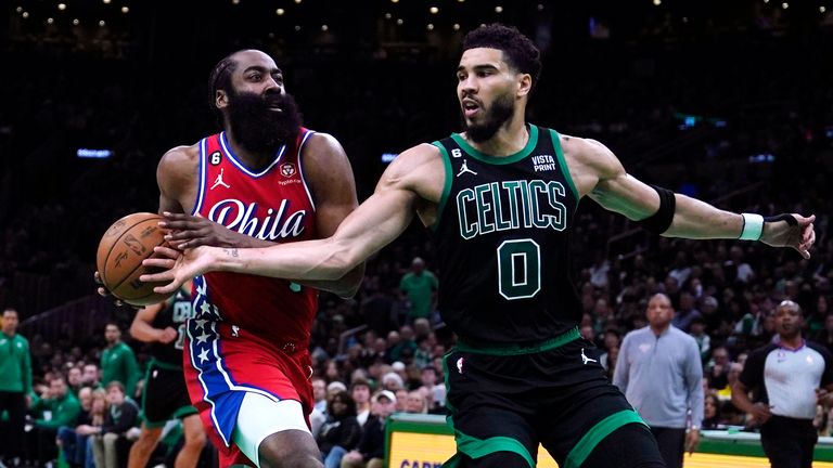 Boston Celtics forward Jayson Tatum tries to steal against Philadelphia 76ers guard James Harden during the first half of Game 1 in the NBA basketball Eastern Conference semifinals playoff series