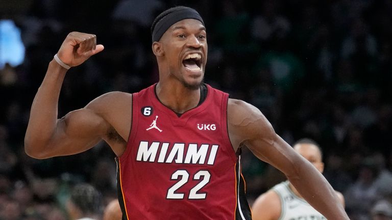 Miami Heat forward Jimmy Butler (22) reacts after scoring against the Boston Celtics during the second half of Game 2 of the NBA basketball playoffs Eastern Conference finals in Boston, Friday, May 19, 2023. (AP Photo/Charles Krupa)