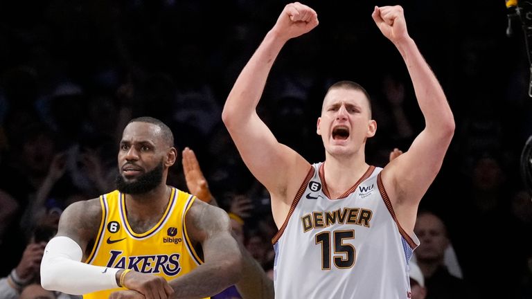 Denver Nuggets center Nikola Jokic (15) celebrates after Los Angeles Lakers forward LeBron James, left, missed a layup attempt as time expired in the second half of Game 4 of the NBA basketball Western Conference Final series Monday, May 22, 2023, in Los Angeles. Denver won 113-111 to win the series. (AP Photo/Ashley Landis)