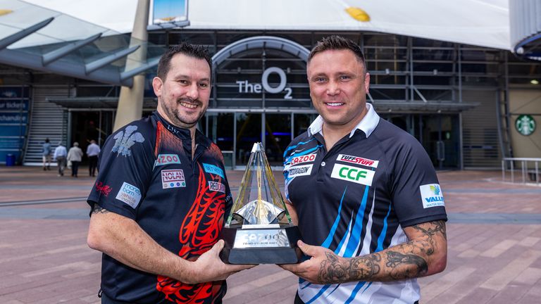 Darts stars Jonny Clayton and Gerwyn Price with the Cazoo Premier League trophy outside of The O2 ahead of the Cazoo Premier League Play-Offs on Thursday. Photo credit should read: Steven Paston/PDC