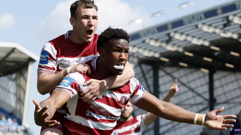 Wigan warriors Junior Nsemba celebrates with Wigan warriors Harry Smith after he scores try against Leeds in Challenge Cup