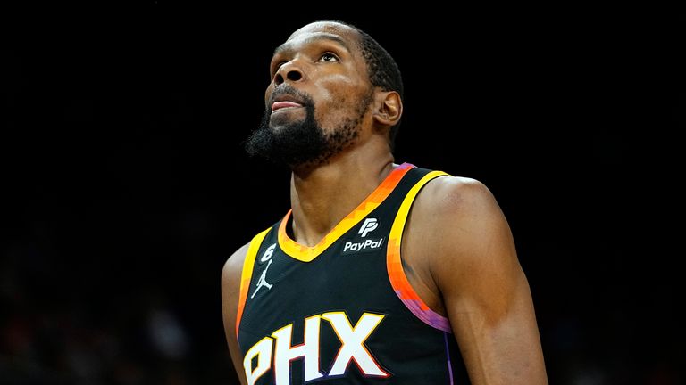 Phoenix Suns forward Kevin Durant looks at the scoreboard during the first half of Game 6 of an NBA basketball Western Conference semifinal series against the Denver Nuggets