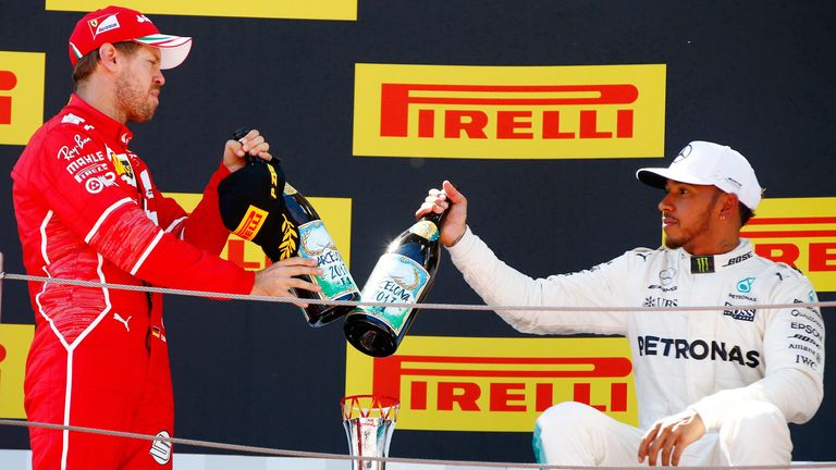 Circuit de Catalunya, Barcelona, Spain..Sunday 14 May 2017..Sebastian Vettel, Ferrari, and Lewis Hamilton, Mercedes AMG, celebrate with champagne on the podium..World Copyright: Andy Hone/LAT Images.ref: Digital Image _ONY6805