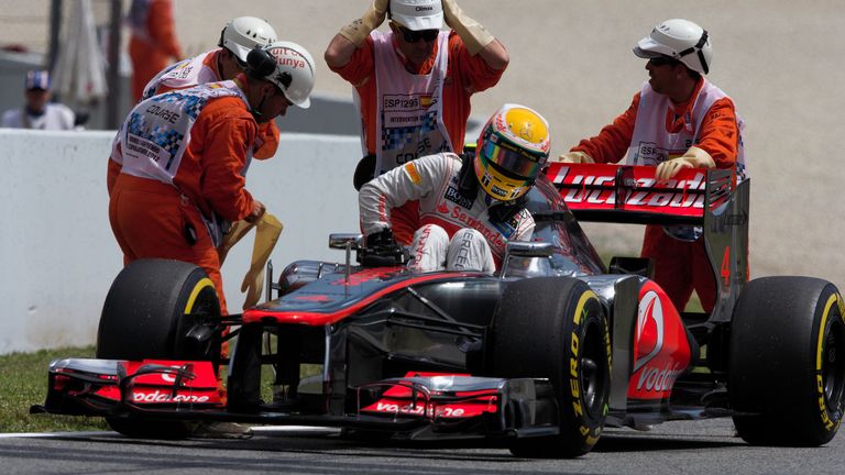 Lewis Hamilton stops on track after taking pole position at the Circuit de Catalunya