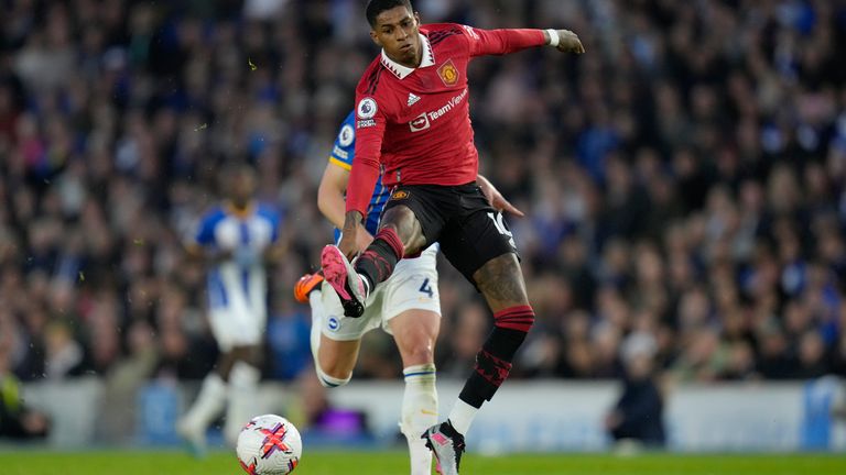 Manchester United's Marcus Rashford controls the ball ahead Brighton's Adam Webster during the English Premier League soccer match between Brighton and Hove Albion and Manchester United at the AMEX stadium in Brighton, England, Thursday, May 4, 2023. (AP Photo/Kirsty Wigglesworth)