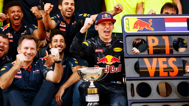 Max Verstappen celebrates his first F1 victory with team-mate Daniel Ricciardo and boss Christian Horner
